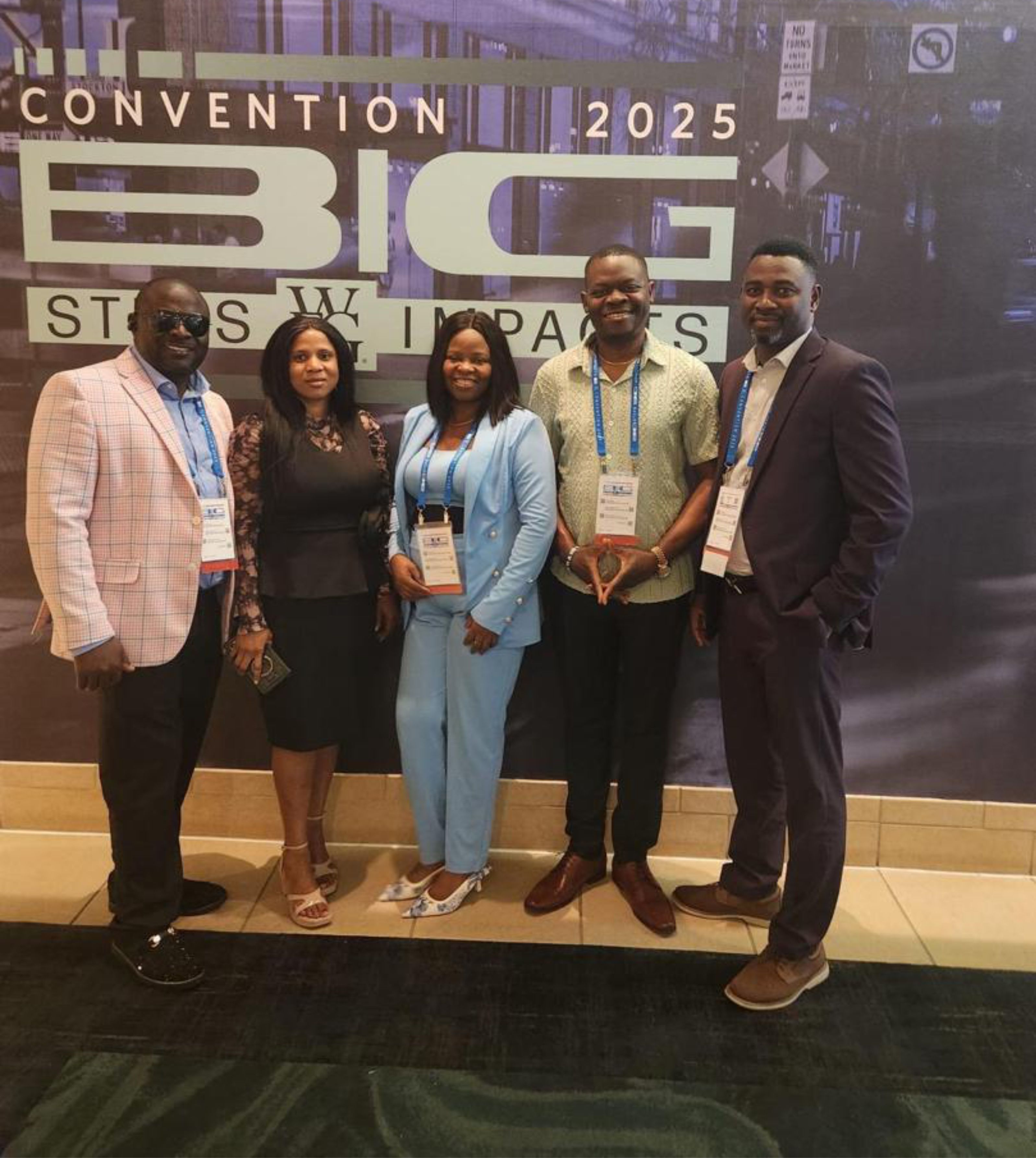 Isaac Oladeji ina an event with team